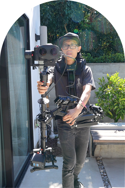 A professional videographer holding the lastest equipments and Camera